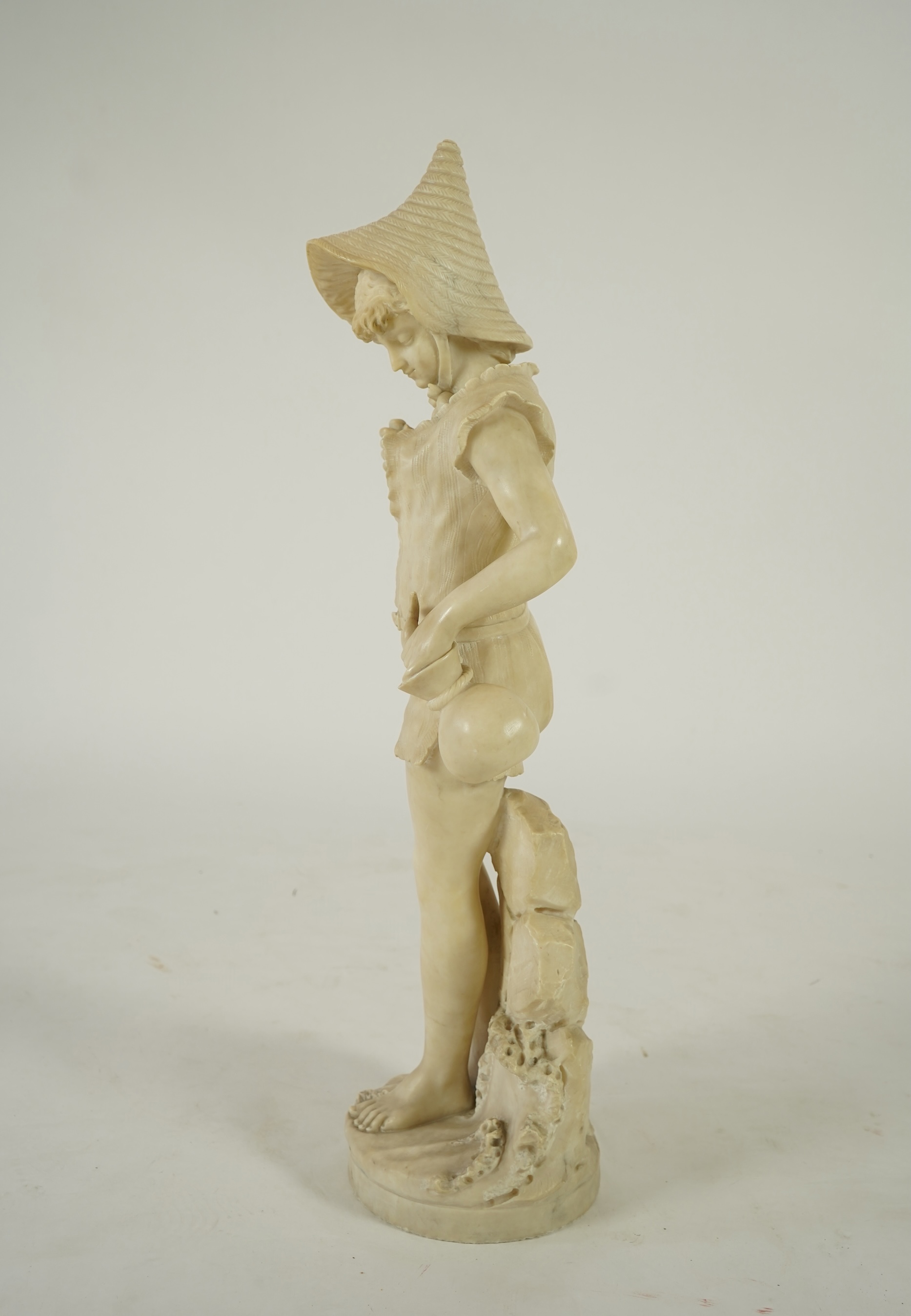 A Continental alabaster figure of a woman fishing, early 20th century